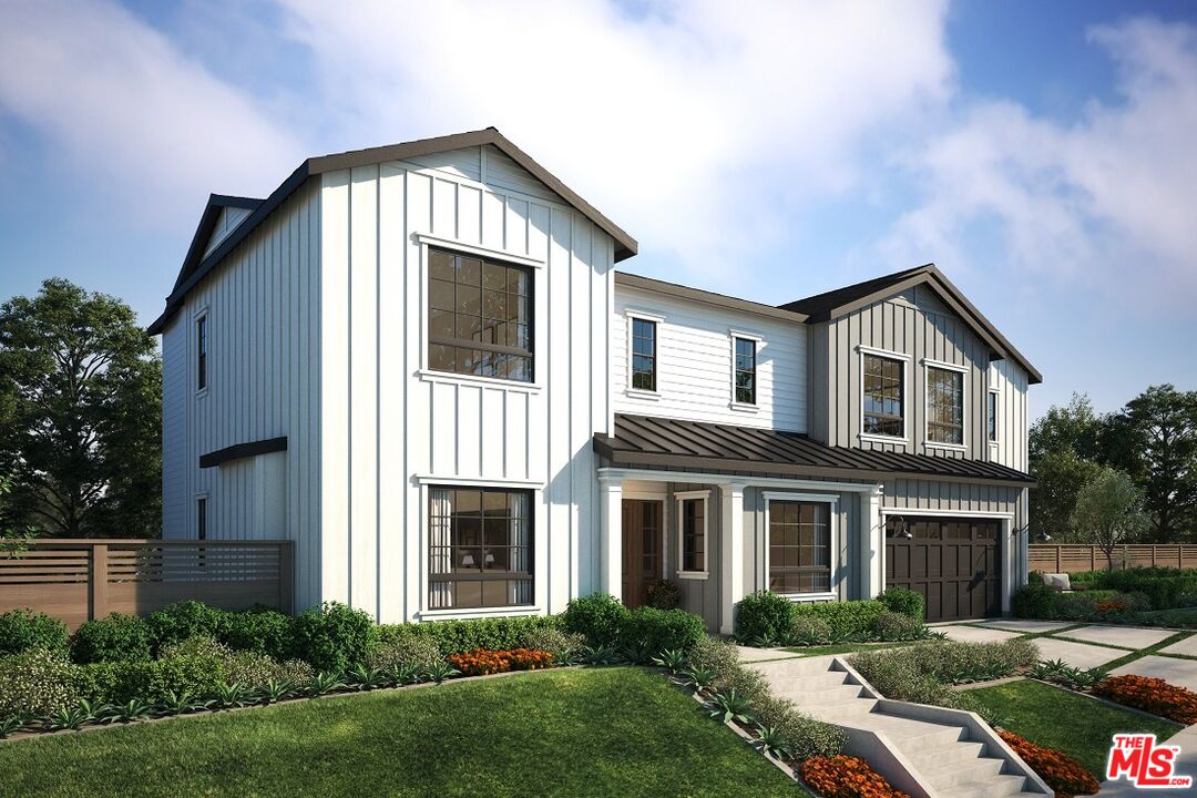 13423 Bayliss Road Los Angeles, CA 90049 - Photo 3 of 9 a front view of a house with garden