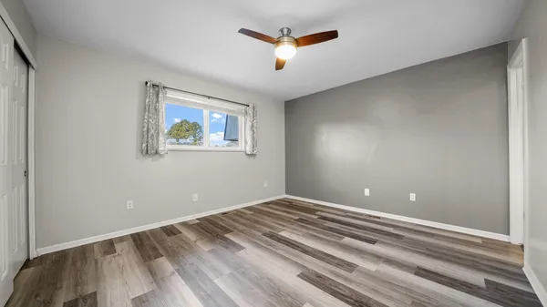 a view of room with window and ceiling fan