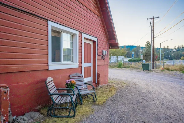 a view of balcony with wooden floor and outdoor seating