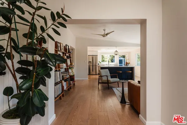 a bed sitting in a room next to a window