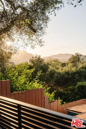 a kitchen with kitchen island white cabinets and stainless steel appliances