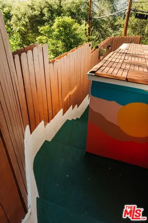 a large kitchen with stainless steel appliances granite countertop a sink and cabinets