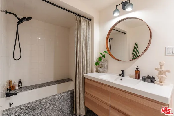 a stove top oven sitting inside of a kitchen