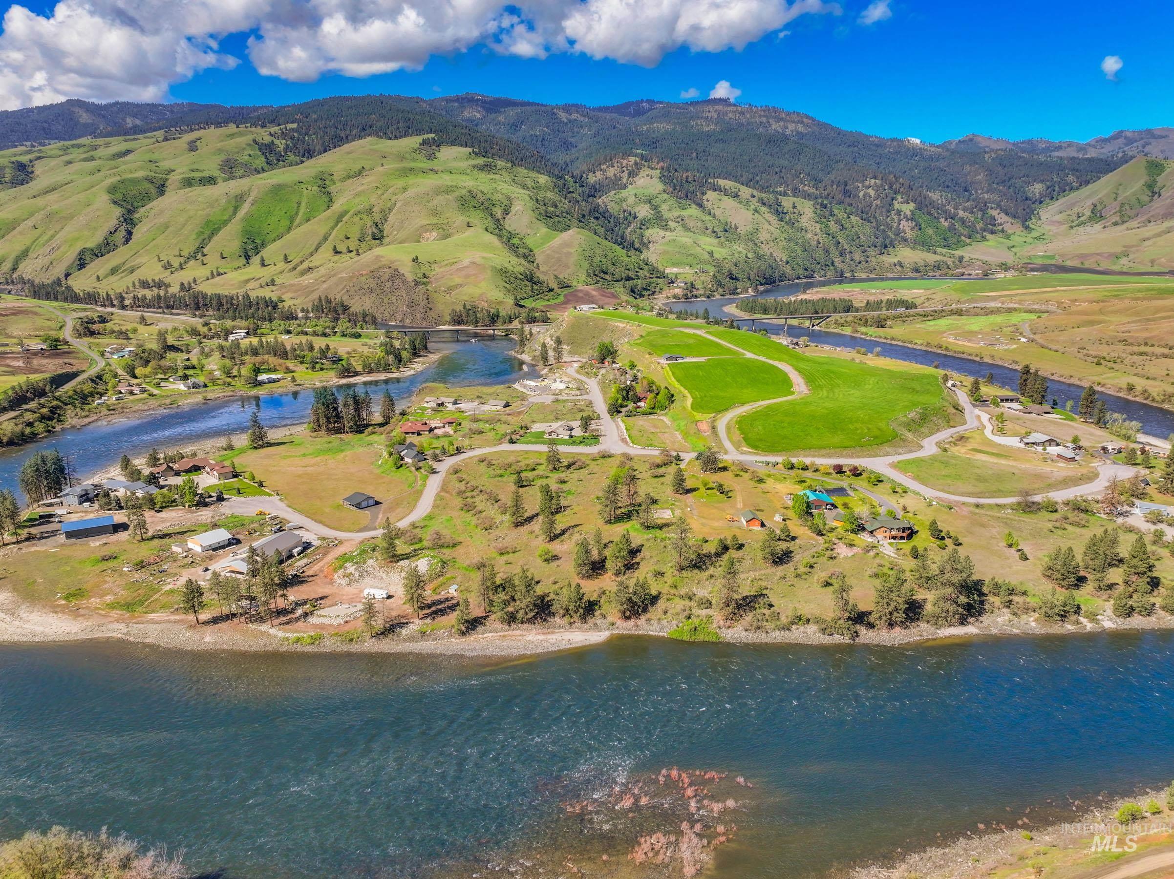113 Deford Road White Bird, ID 83554 - Photo 47 of 49 Expansive riverfront property with winding roads, scattered residential structures, and extensive green spaces