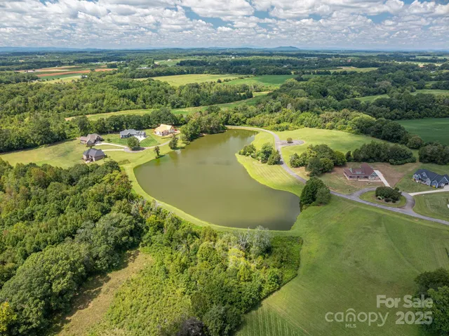 a view of a lake with a yard