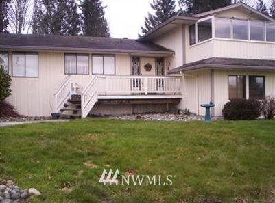 14613 Three Lakes Road Snohomish, WA 98290 - Photo 1 of 1 a front view of a house with a garden