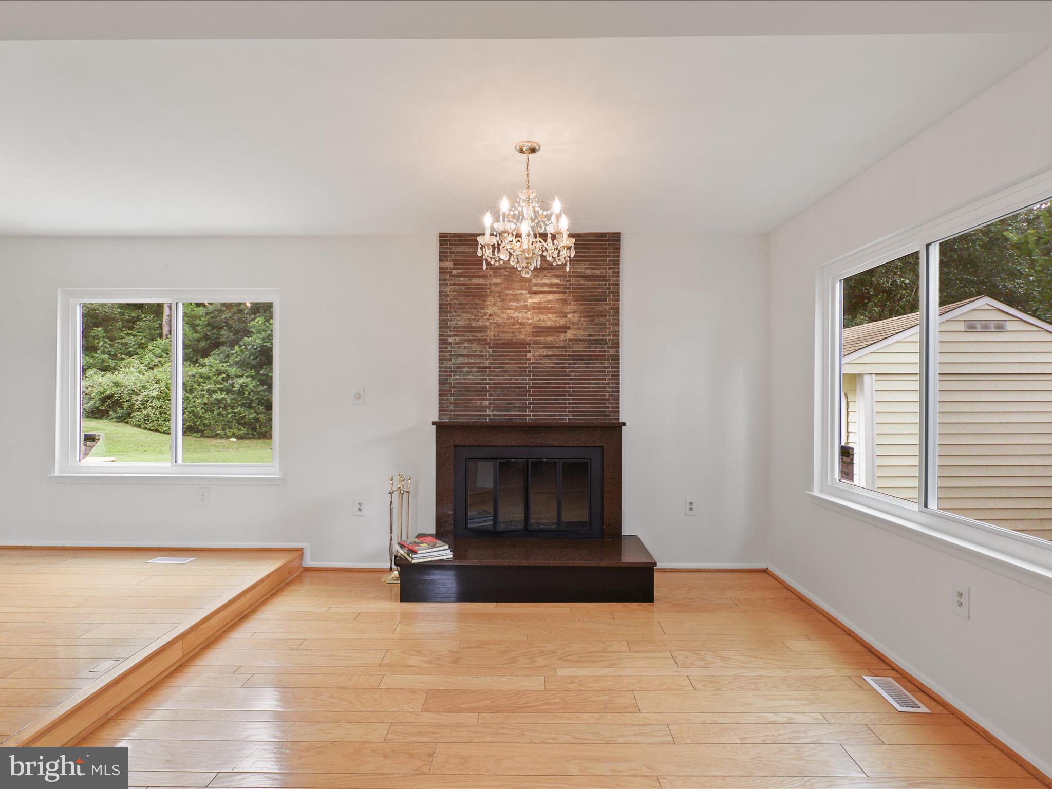 5922 Hall Street Springfield, VA 22152 - Photo 12 of 47 an empty room with windows and fireplace