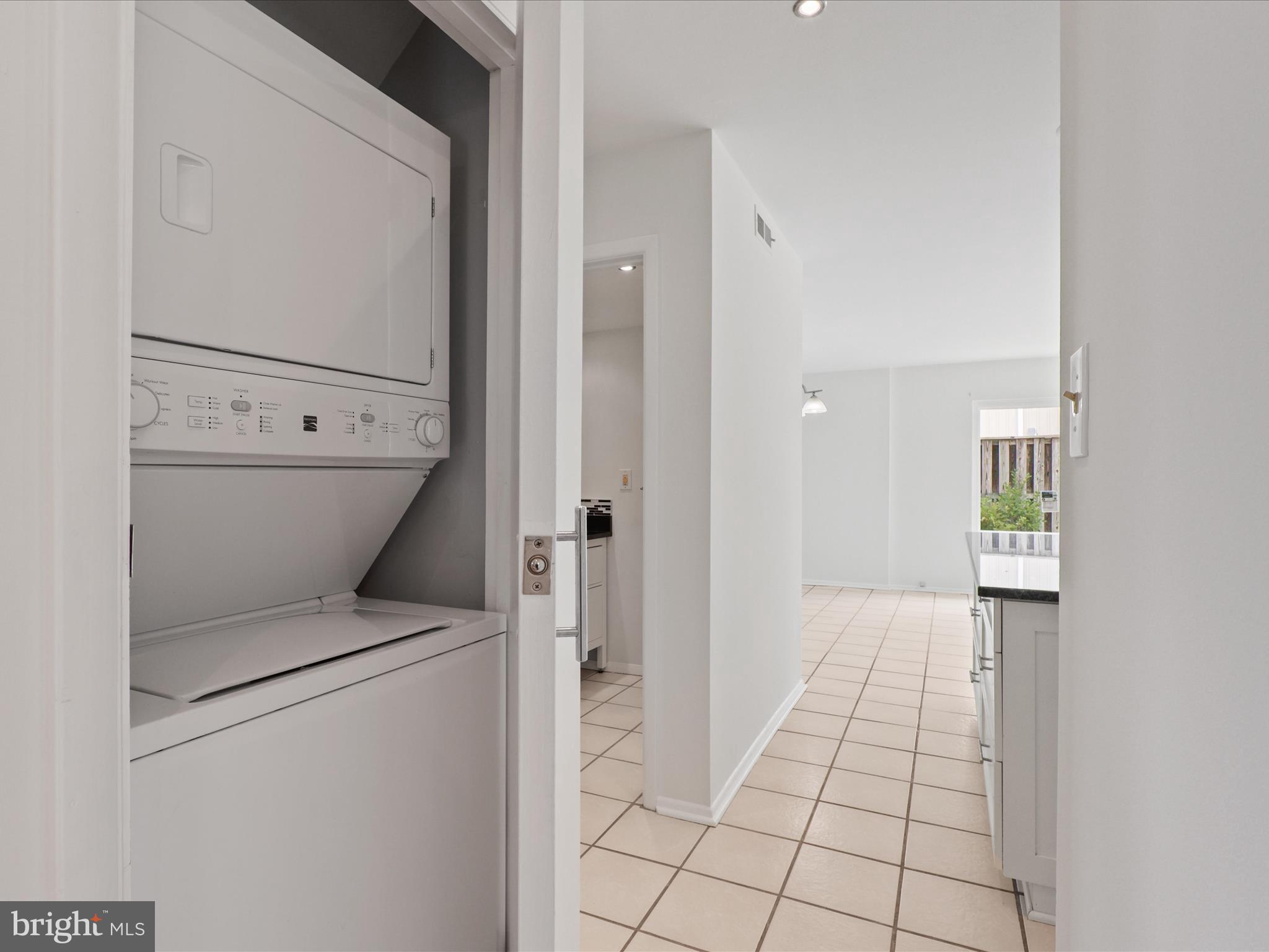5922 Hall Street Springfield, VA 22152 - Photo 14 of 47 a view of a storage & utility room with washer and dryer