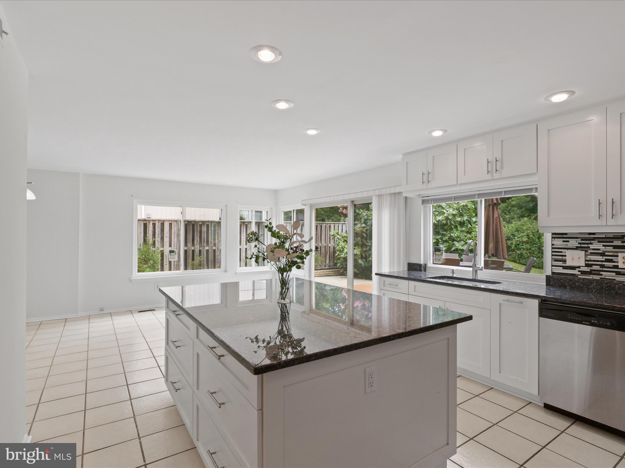 5922 Hall Street Springfield, VA 22152 - Photo 15 of 47 a kitchen with granite countertop a sink and stove