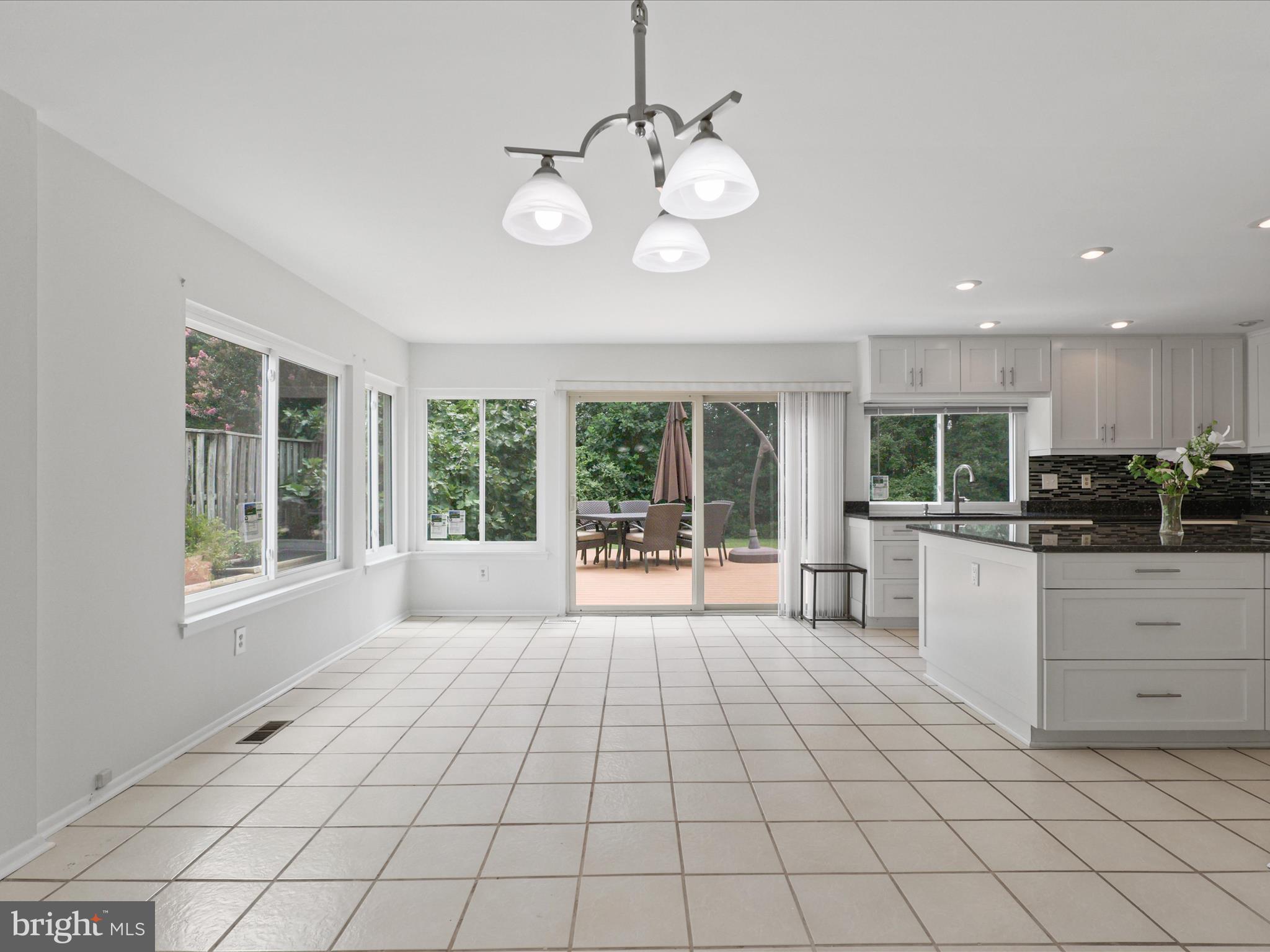 5922 Hall Street Springfield, VA 22152 - Photo 21 of 47 a large white kitchen with a large window
