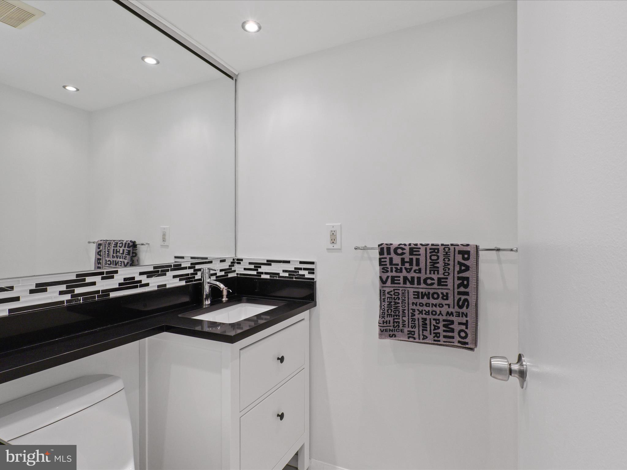 5922 Hall Street Springfield, VA 22152 - Photo 22 of 47 a kitchen with a sink and cabinets