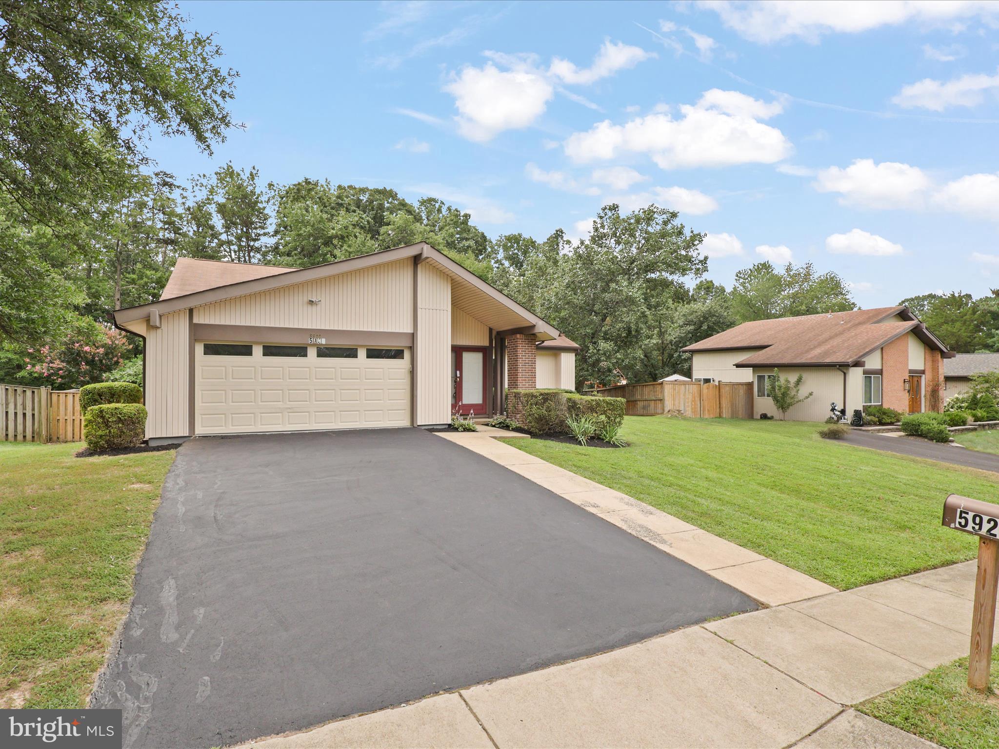 5922 Hall Street Springfield, VA 22152 - Photo 3 of 47 a view of an house with backyard space and garden