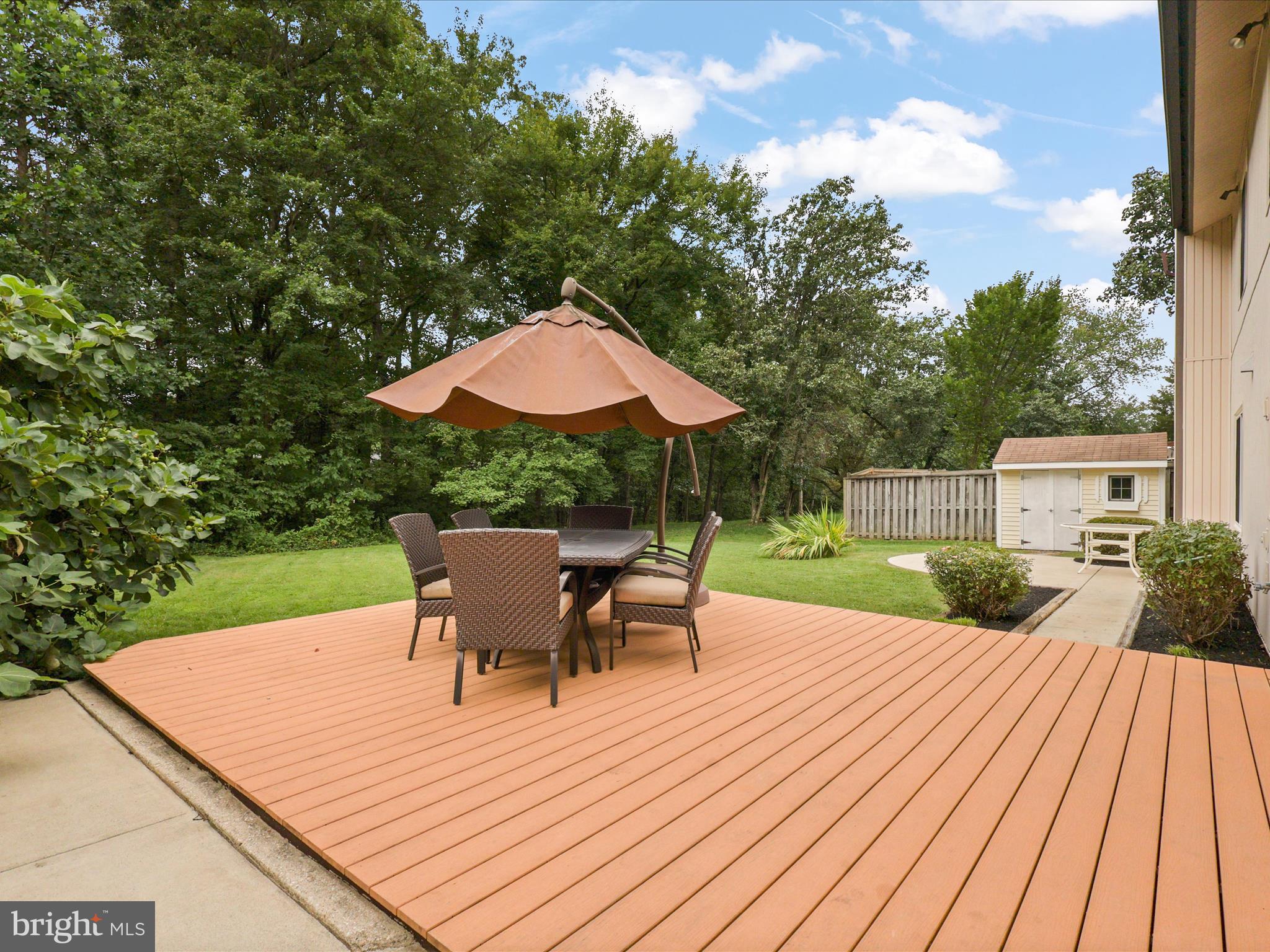 5922 Hall Street Springfield, VA 22152 - Photo 36 of 47 a view of a patio with table and chairs with wooden floor and fence
