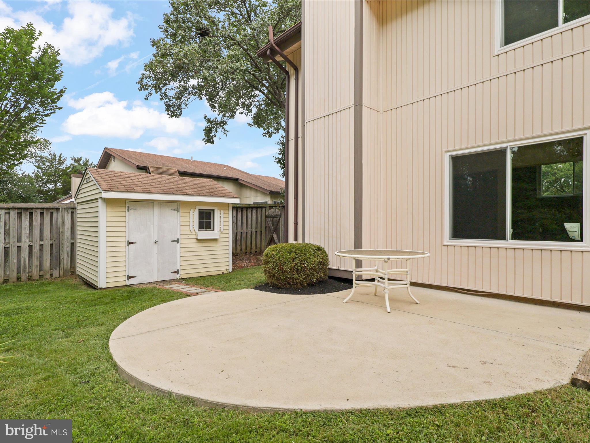 5922 Hall Street Springfield, VA 22152 - Photo 37 of 47 a backyard of a house with yard and garage