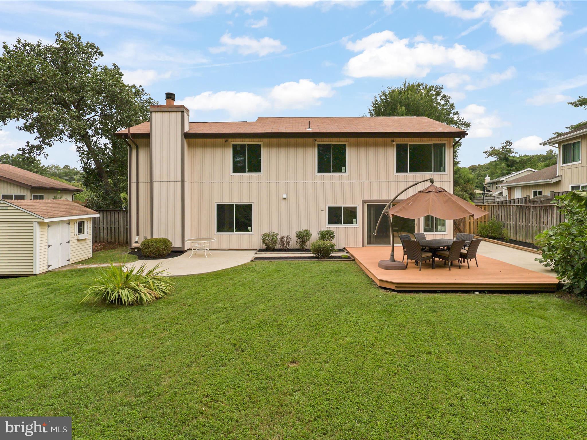 5922 Hall Street Springfield, VA 22152 - Photo 39 of 47 a view of a house with backyard sitting area and garden