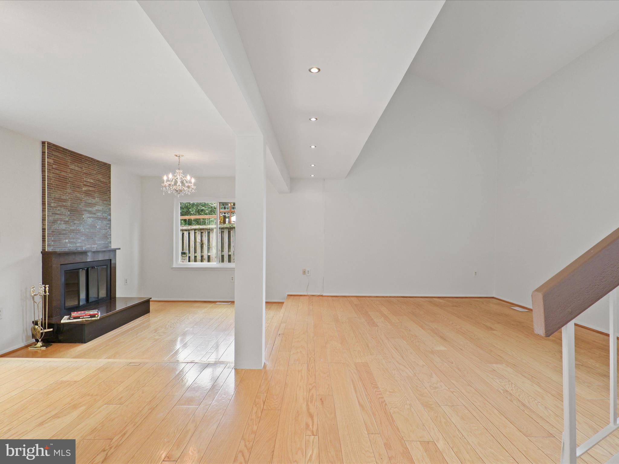 5922 Hall Street Springfield, VA 22152 - Photo 8 of 47 a view of an empty room with a fireplace