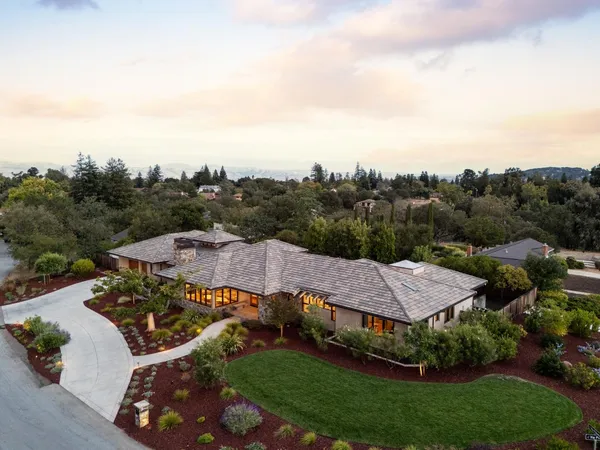 an aerial view of residential houses and outdoor space