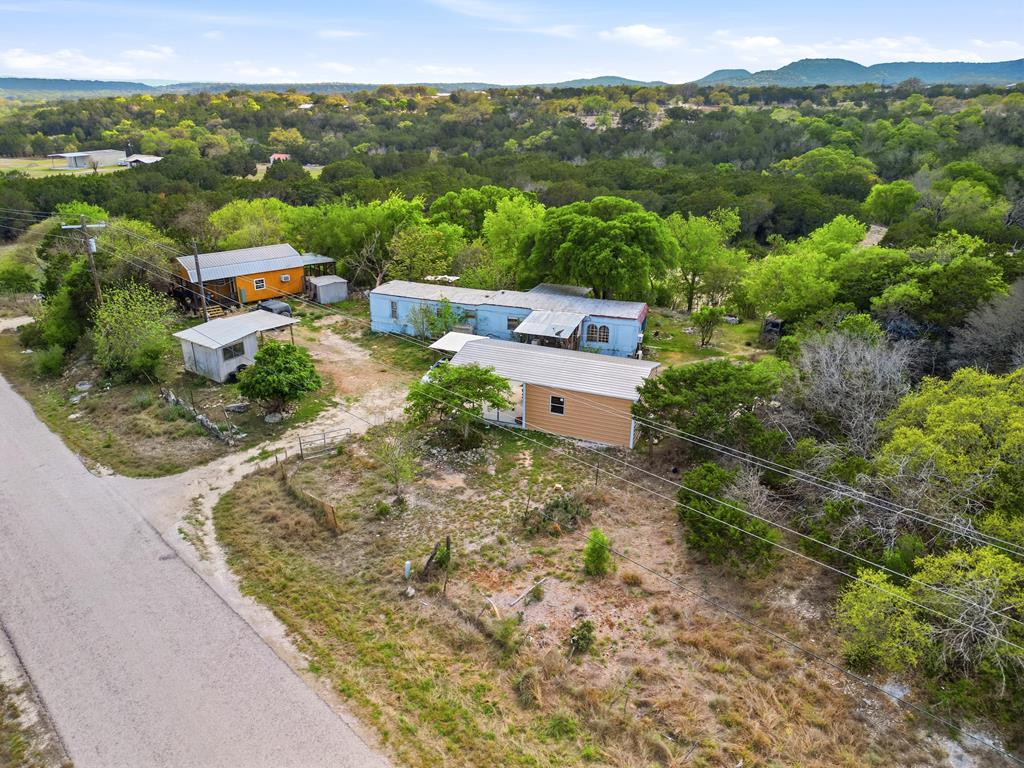 313 Elm Pass II Road East Center Point, TX 78010 - Photo 1 of 37 an aerial view of a house with a garden