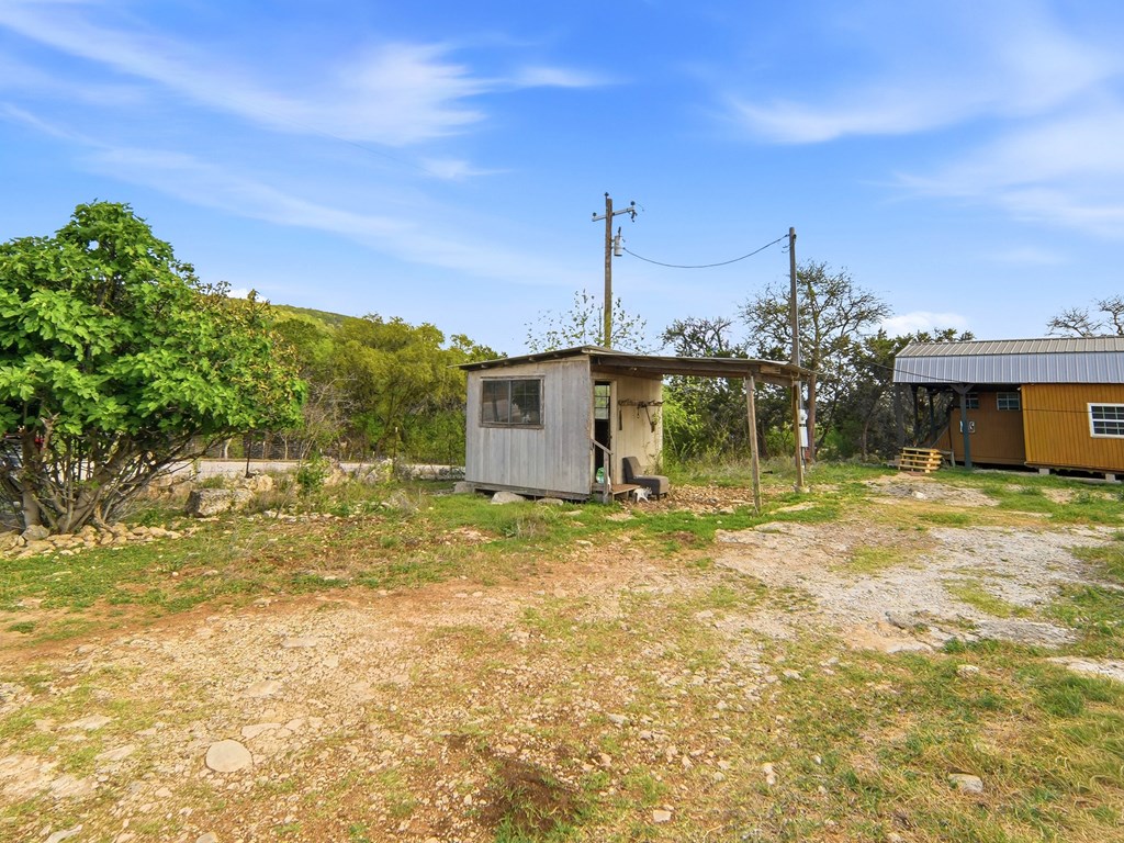 313 Elm Pass II Road East Center Point, TX 78010 - Photo 14 of 37 a view of a house with a backyard