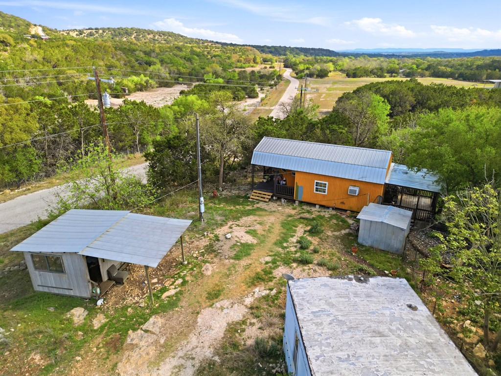 313 Elm Pass II Road East Center Point, TX 78010 - Photo 19 of 37 a view of a yard with an outdoor seating