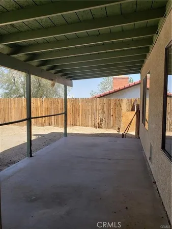 a view of a backyard of the house