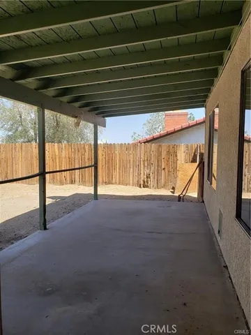 a view of a backyard of the house