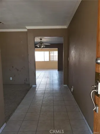a hallway with sliding door and yard in back