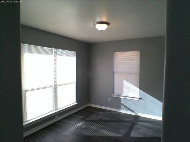 a view of an empty room and a window