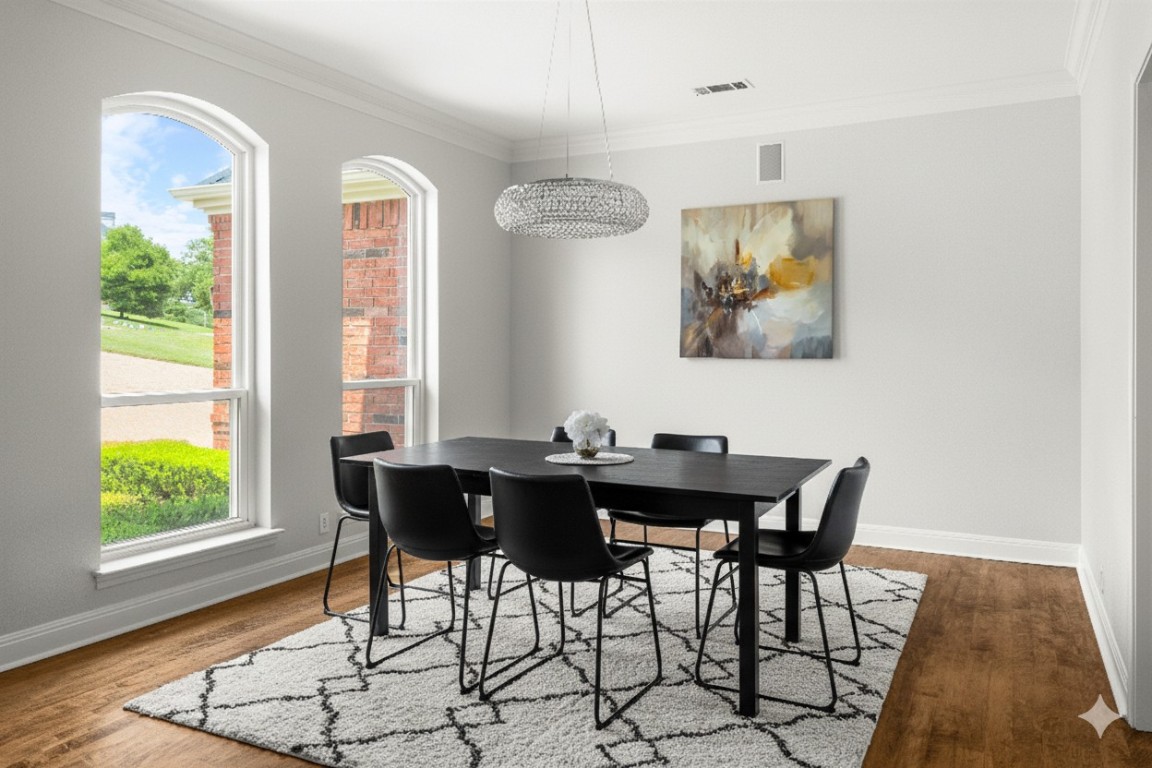 2807 Round Table Road Austin, TX 78746 - Photo 11 of 38 Dining space featuring crown molding and wood finished floors