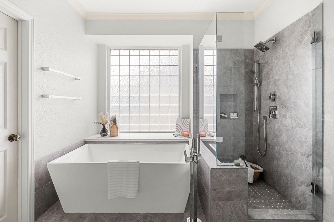 2807 Round Table Road Austin, TX 78746 - Photo 15 of 38 Luxurious Primary Bathroom includes High-end finishes include Caesarstone Imperia White countertops, a Wyndham freestanding tub, dual Miseno rectangular sinks, and a walk-in shower with premium fixtures.