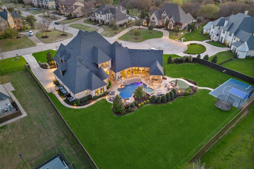 an aerial view of an house with swimming pool and outdoor space