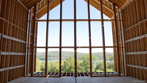 a view of an room with floor to ceiling windows