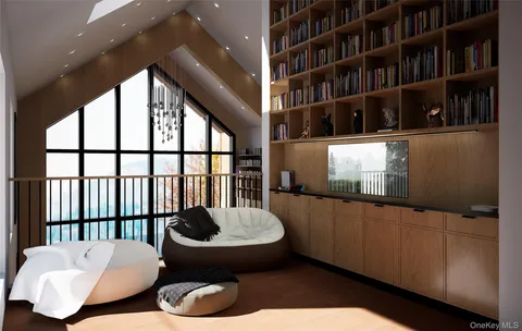 a living room with couches and a bookshelf