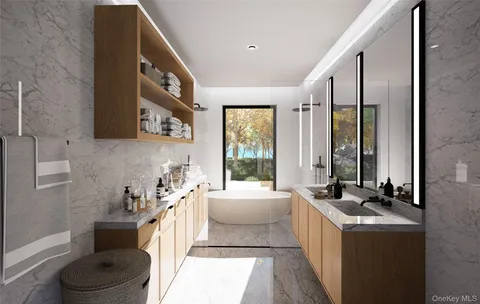a spacious bathroom with a bathtub sink and mirror