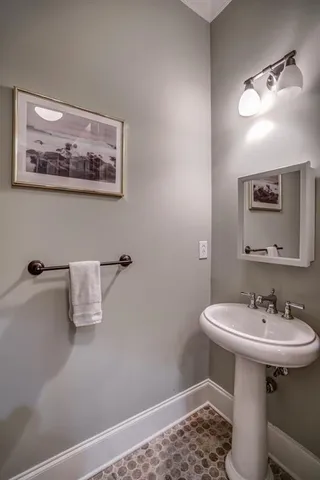 a bathroom with a sink a mirror and a toilet