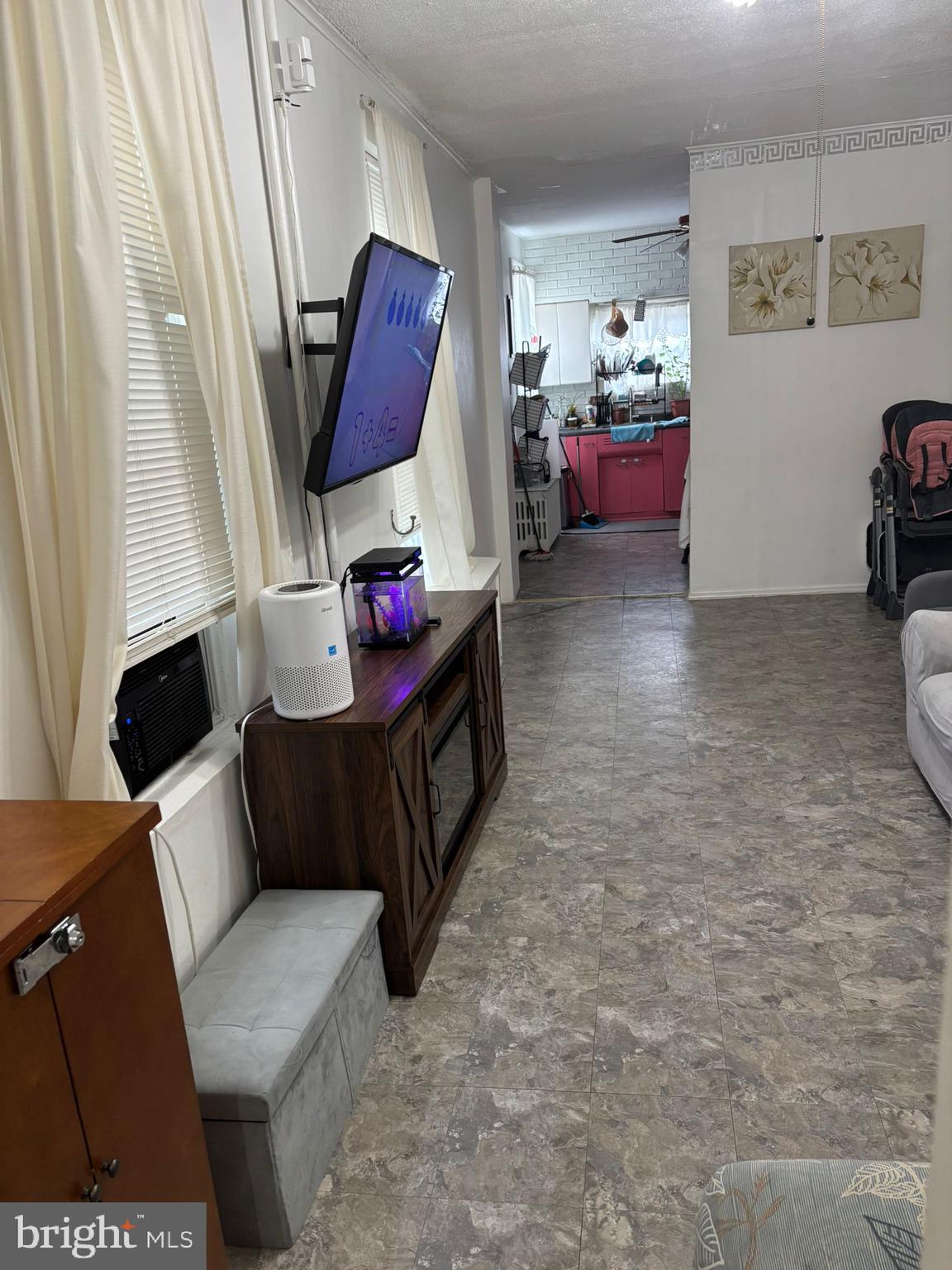 439 Buttonwood Street Reading, PA 19601 - Photo 13 of 33 a living room with furniture and a flat screen tv