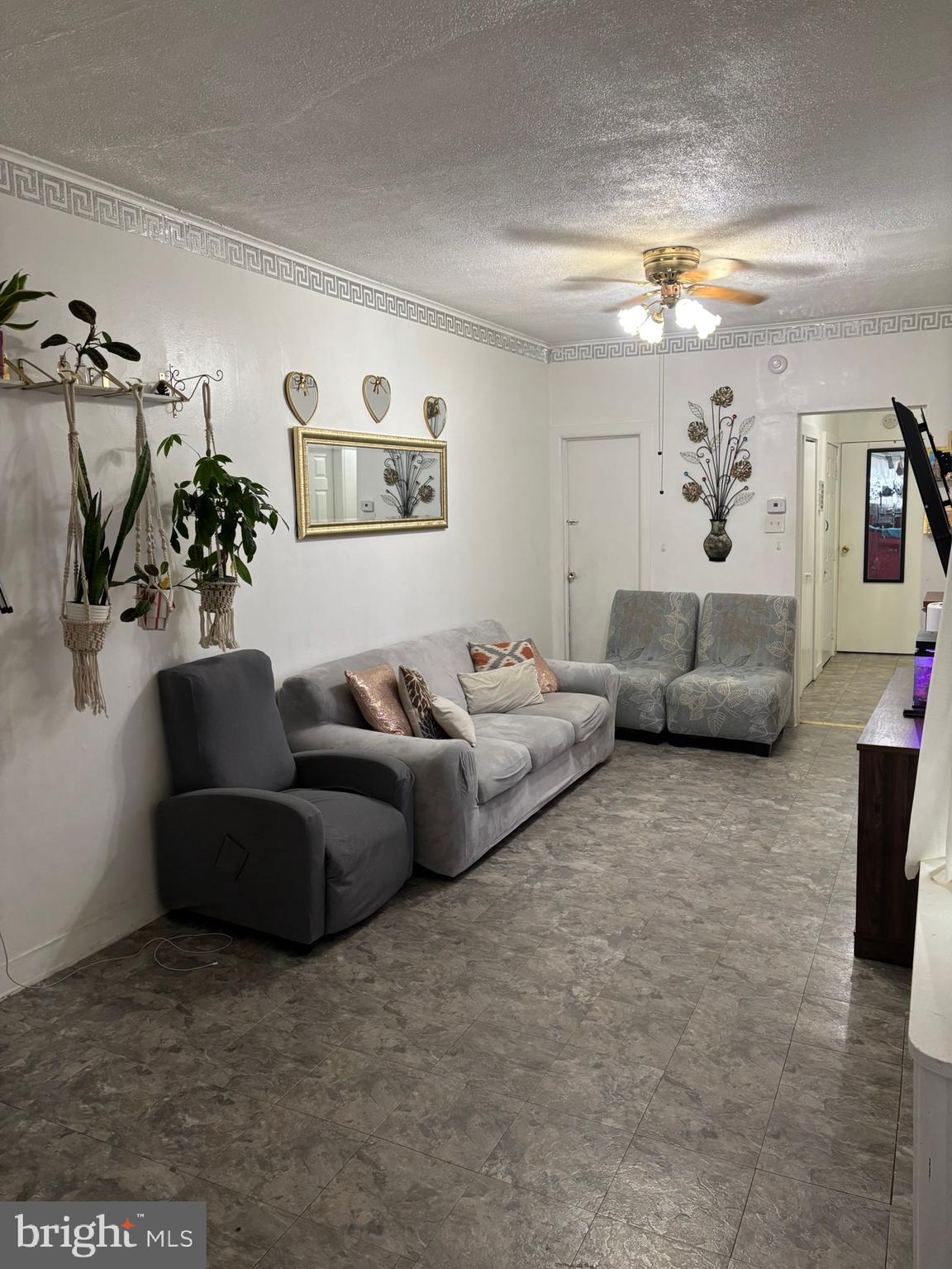 439 Buttonwood Street Reading, PA 19601 - Photo 10 of 33 a living room with furniture and a flat screen tv