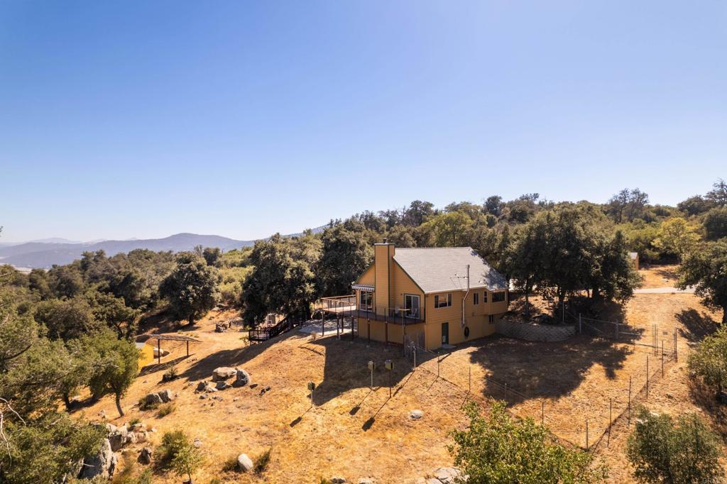 25770 East Grade Road Santa Ysabel, CA 92070 - Photo 7 of 75 a view of a house with a yard covered in snow