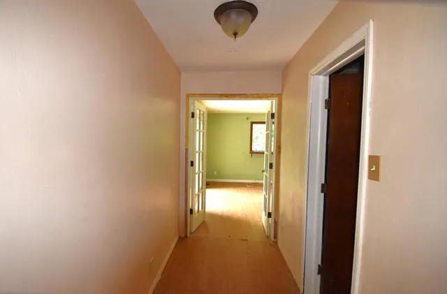 a view of a bathroom from a hallway