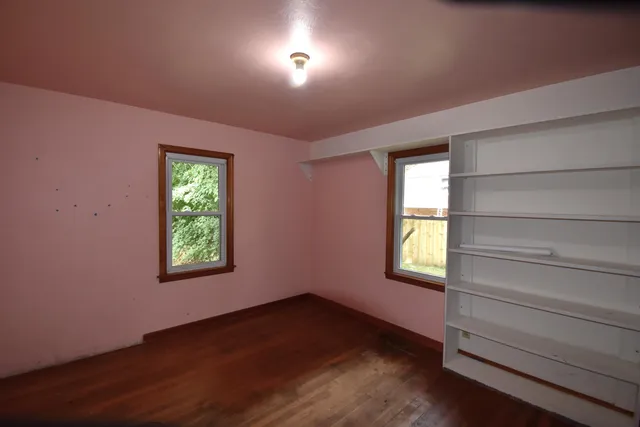 an empty room with windows