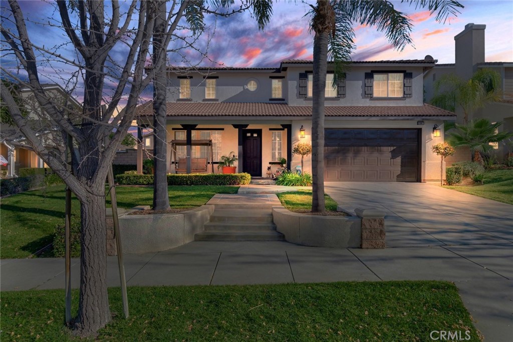 2967 Mangular Avenue Corona, CA 92882 - Photo 1 of 37 a view of a yard in front of the house