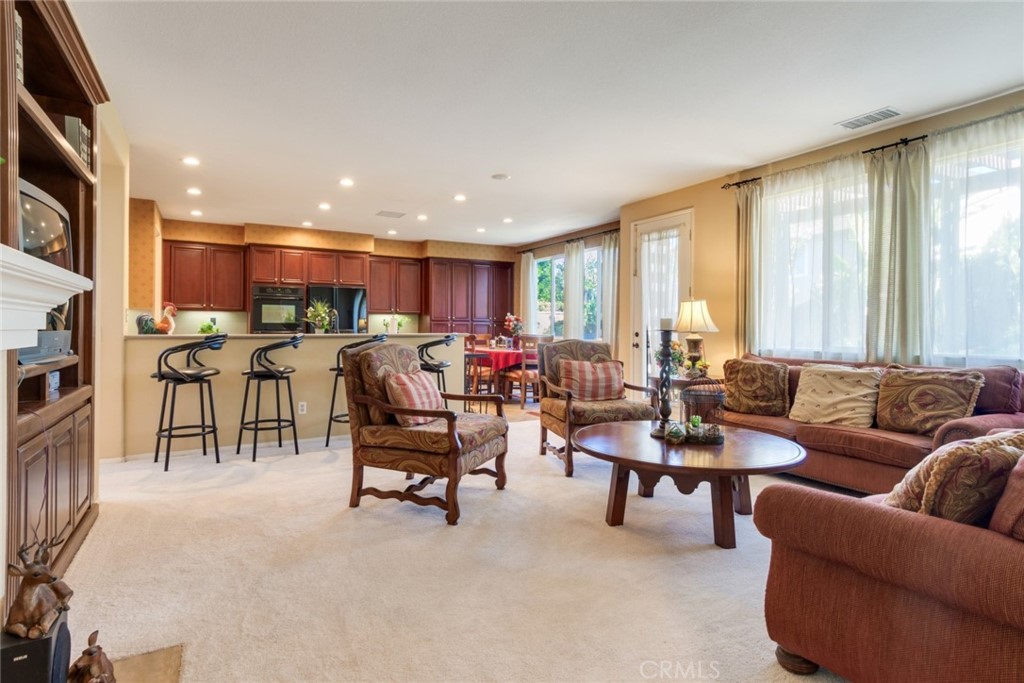 2967 Mangular Avenue Corona, CA 92882 - Photo 11 of 37 a living room with furniture and a large window