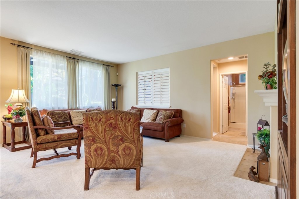 2967 Mangular Avenue Corona, CA 92882 - Photo 12 of 37 a living room with furniture and a window