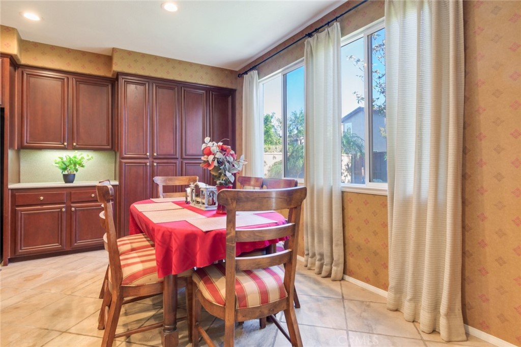 2967 Mangular Avenue Corona, CA 92882 - Photo 14 of 37 a view of a dining room with furniture and window