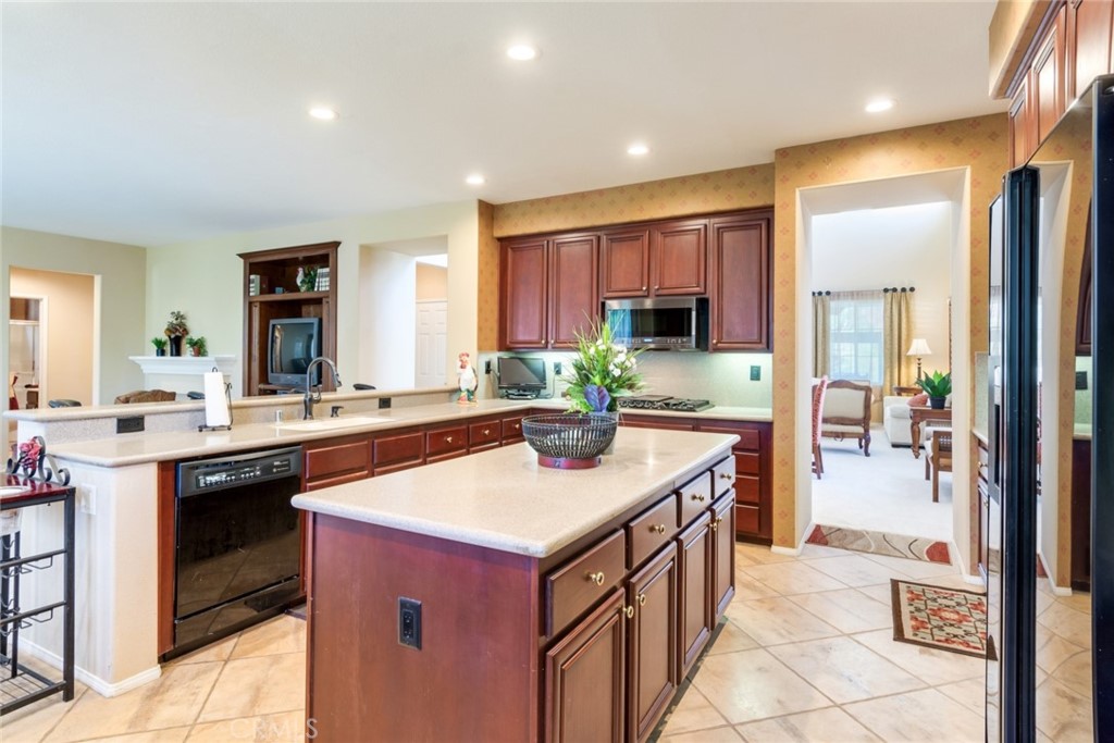2967 Mangular Avenue Corona, CA 92882 - Photo 16 of 37 a kitchen with a sink and stove