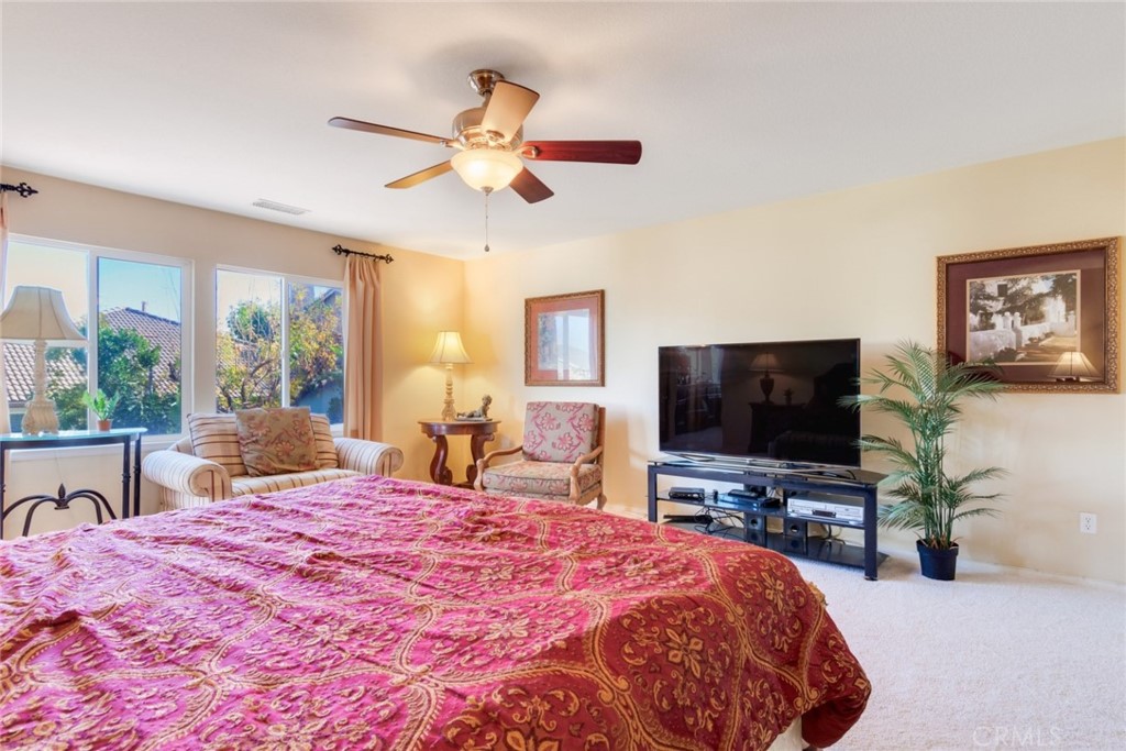 2967 Mangular Avenue Corona, CA 92882 - Photo 20 of 37 a bedroom with a bed and a flat screen tv