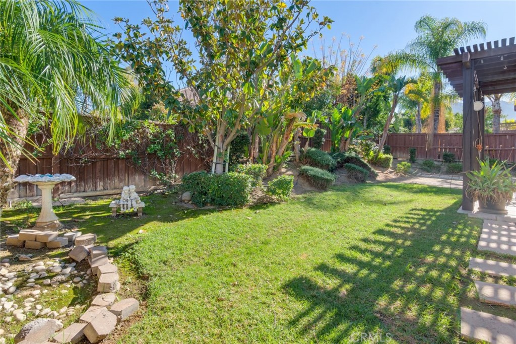 2967 Mangular Avenue Corona, CA 92882 - Photo 34 of 37 a view of a garden with a tree