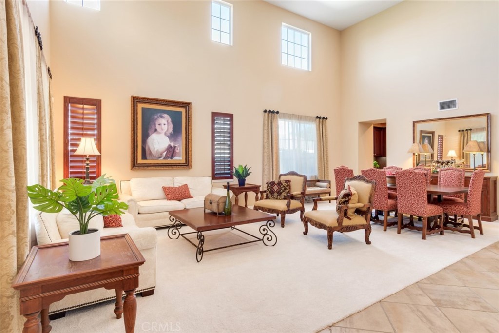 2967 Mangular Avenue Corona, CA 92882 - Photo 5 of 37 a living room with furniture and a potted plant