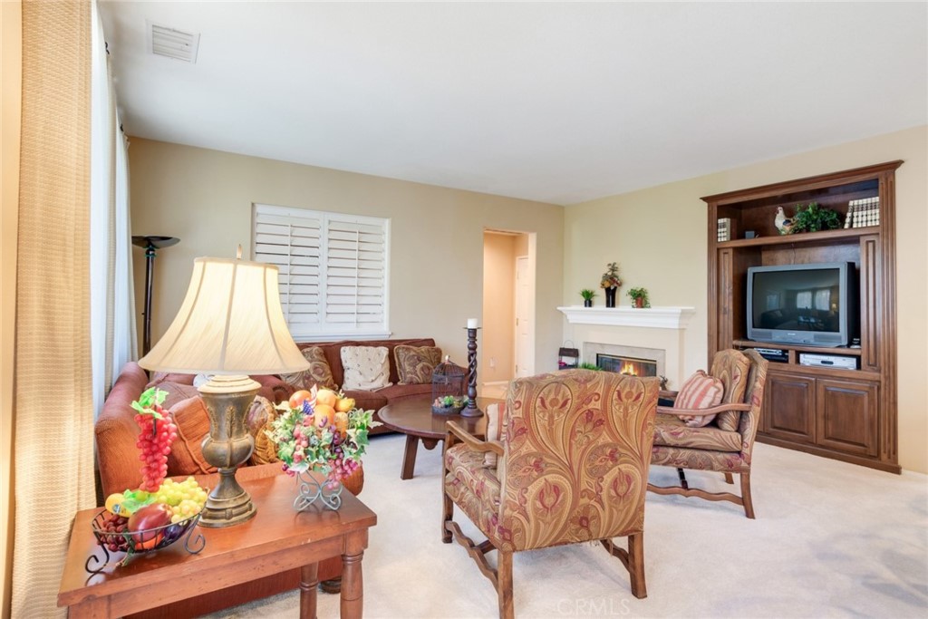 2967 Mangular Avenue Corona, CA 92882 - Photo 10 of 37 a living room with furniture and a flat screen tv