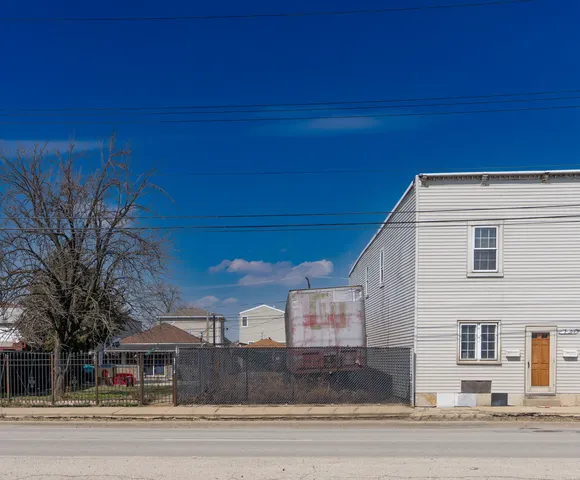 a view of a house with a road